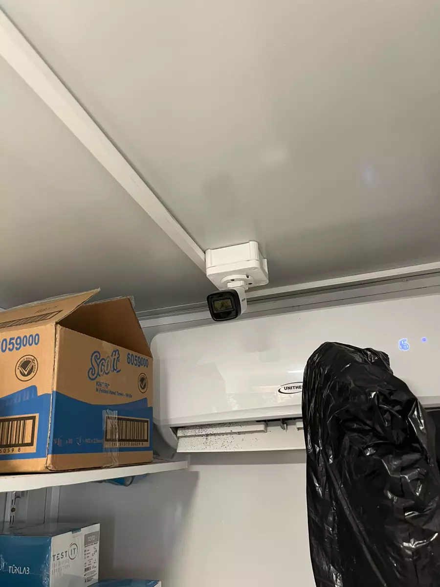 Indoor security camera mounted on a wall